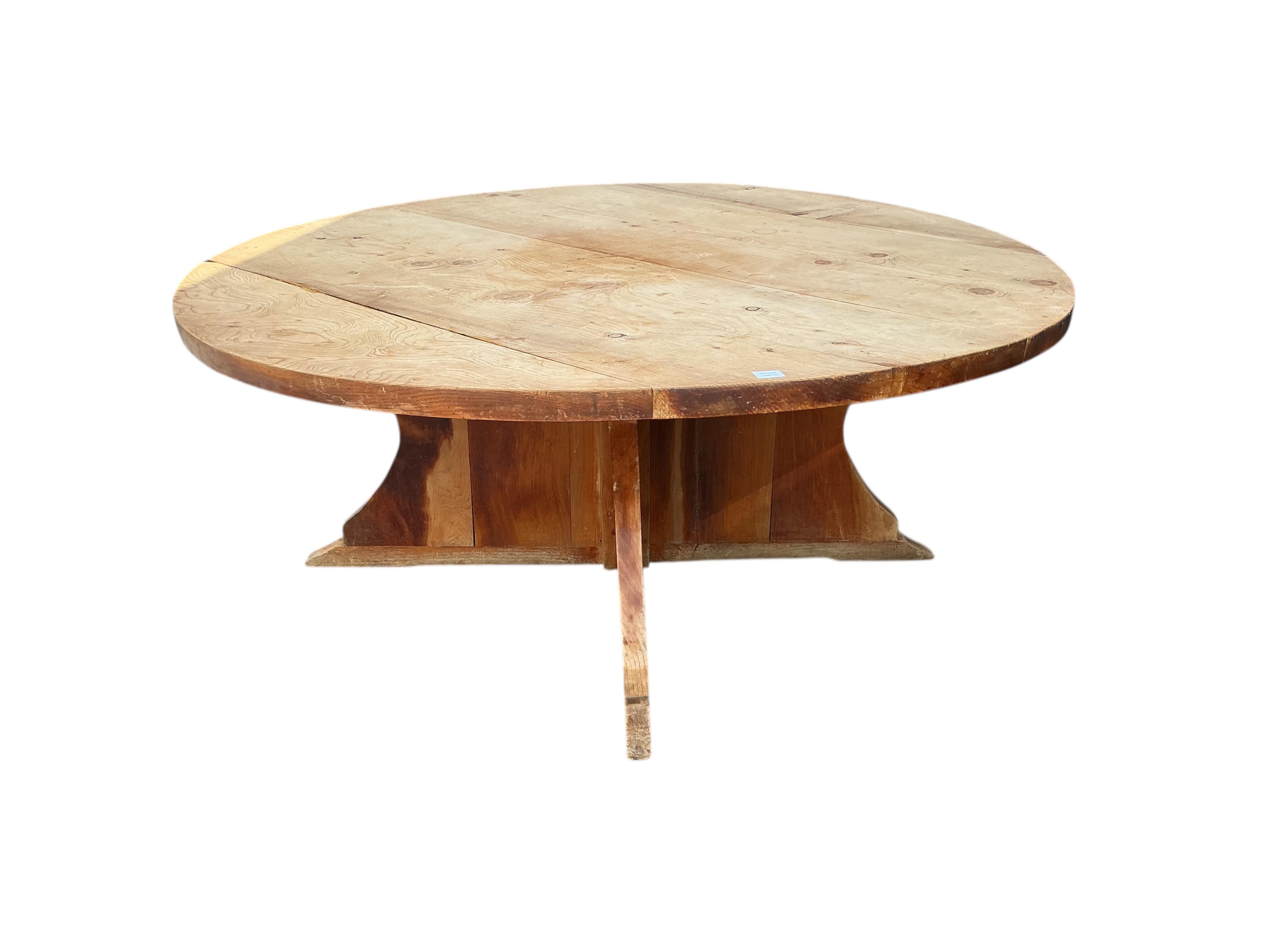 A large circular pine breakfast table, diameter 181cm, height 72cm